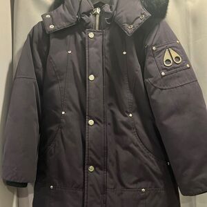 Navy blue Moose Knuckle winter jacket with black fur. Size kids small unisex.